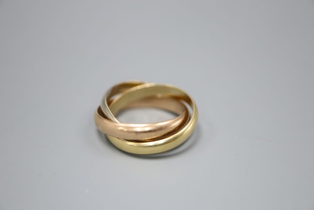 A Must de Cartier three colour 18ct gold Russian triple band wedding ring, numbered 0 6373 L, size M, 8.3 grams